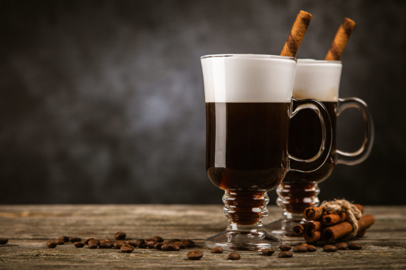 Hot Irish coffee with whiskey and cream